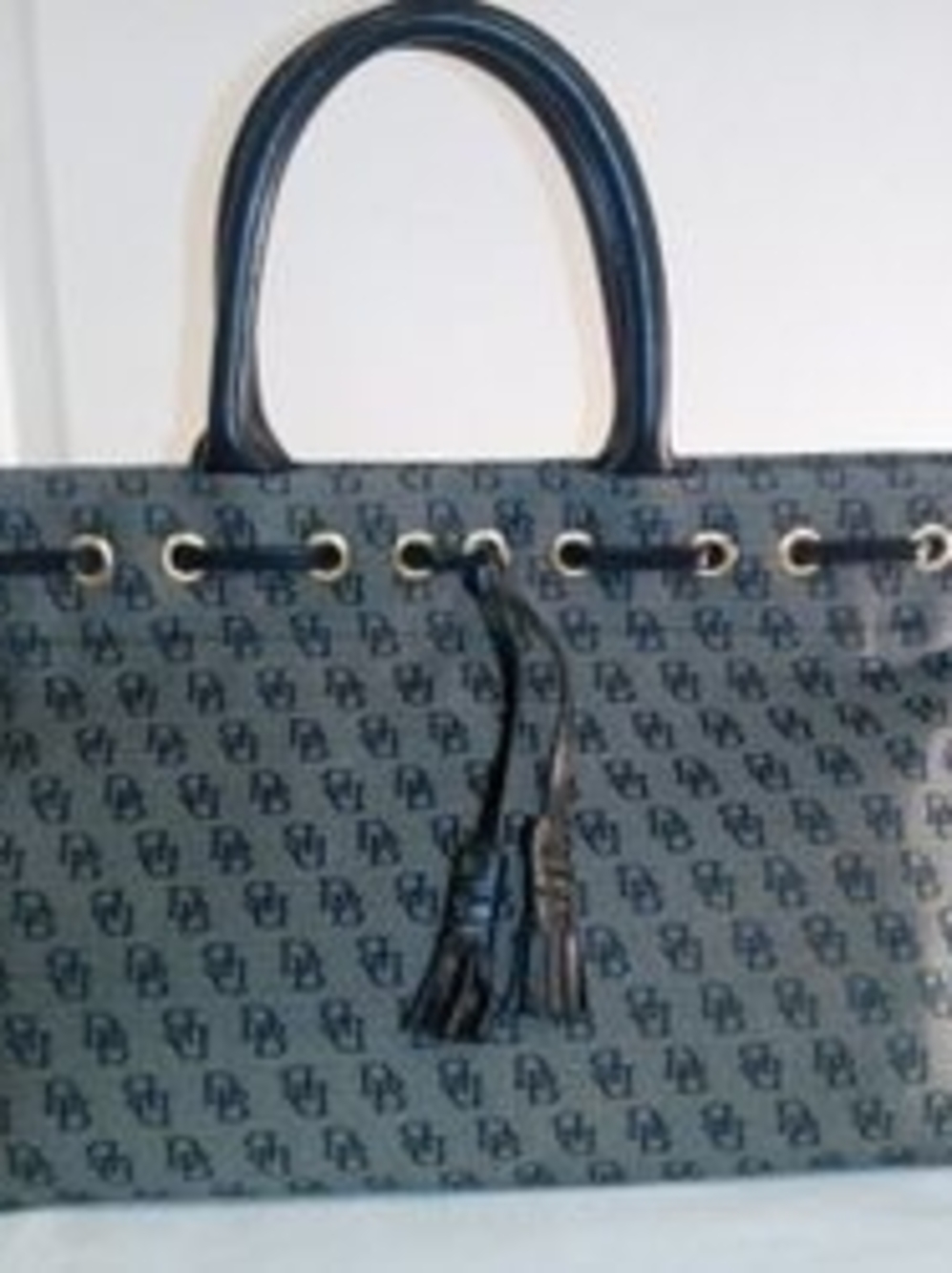 Dooney & Bourke Gray Canvas Shoulder Bag with Black Leather Trim.